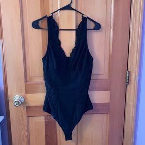 Bebe black lace/sheer bodysuit open back and snap closure